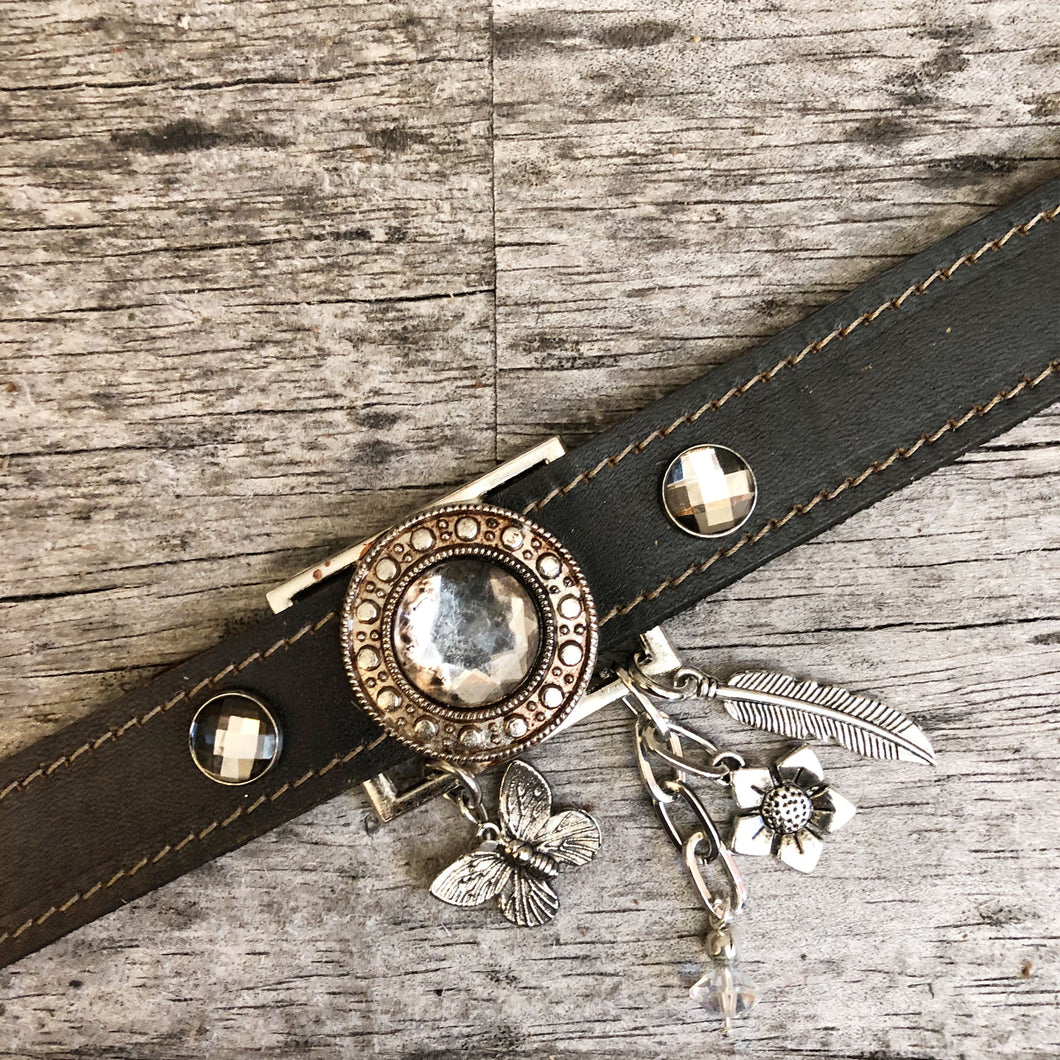 Leather boot bracelet featuring crystal concho and charms