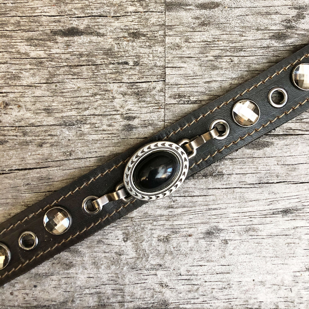 Leather boot bracelet with black cabochon style concho and crystals rivets