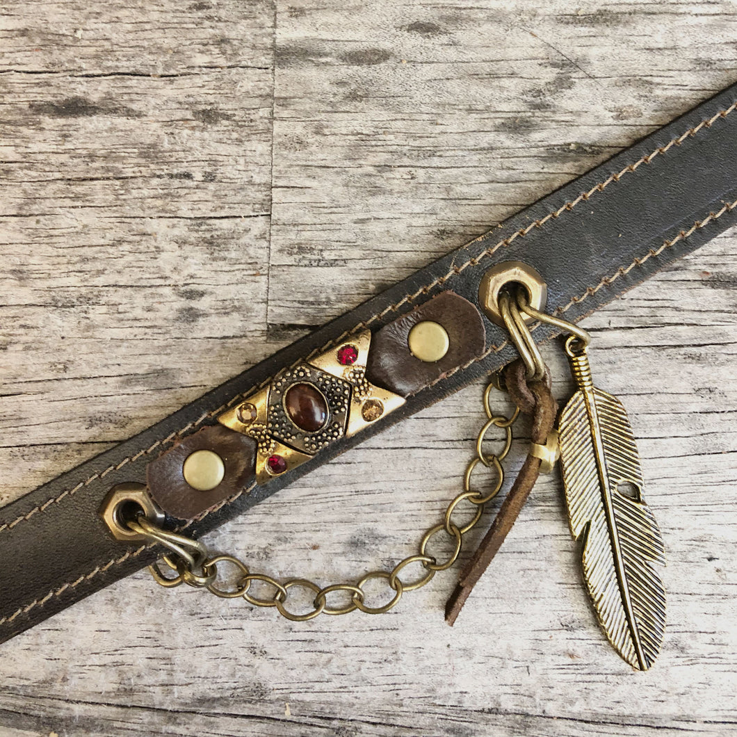 Leather boot bracelet accented with  vintage cabochon beads, crystals and charms